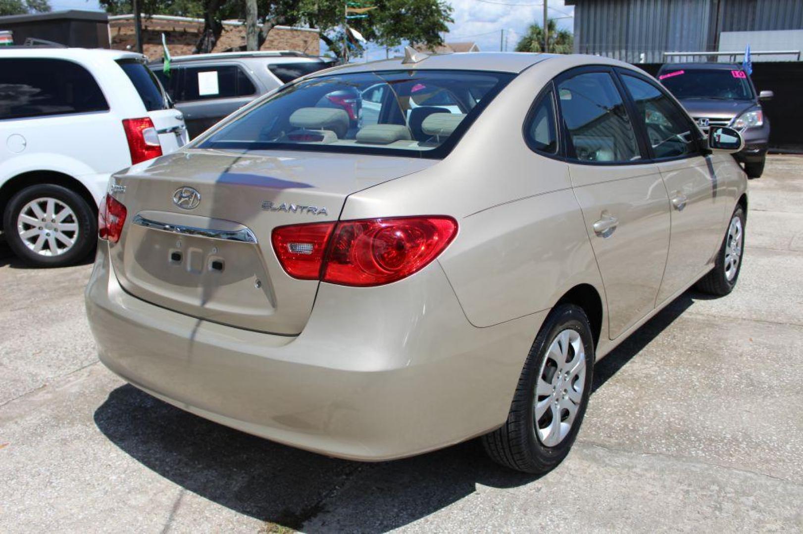 2010 GOLD HYUNDAI ELANTRA GLS (KMHDU4AD8AU) with an 2.0L engine, Automatic transmission, located at 6921 40th St N, Pinellas Park, FL, 33781, (727) 366-8136, 27.834944, -82.687653 - Gorgeous Elantra, Extremely Clean inside and out with Super low miles. Just been Fully Serviced and inspected. Brand New Tires Installed, New Brakes, Fresh Oil and Filter Change. This Vehicle is reliable and will take you anywhere in style and comfort. Would make a Great Student Car, Commuter GAS - Photo#4