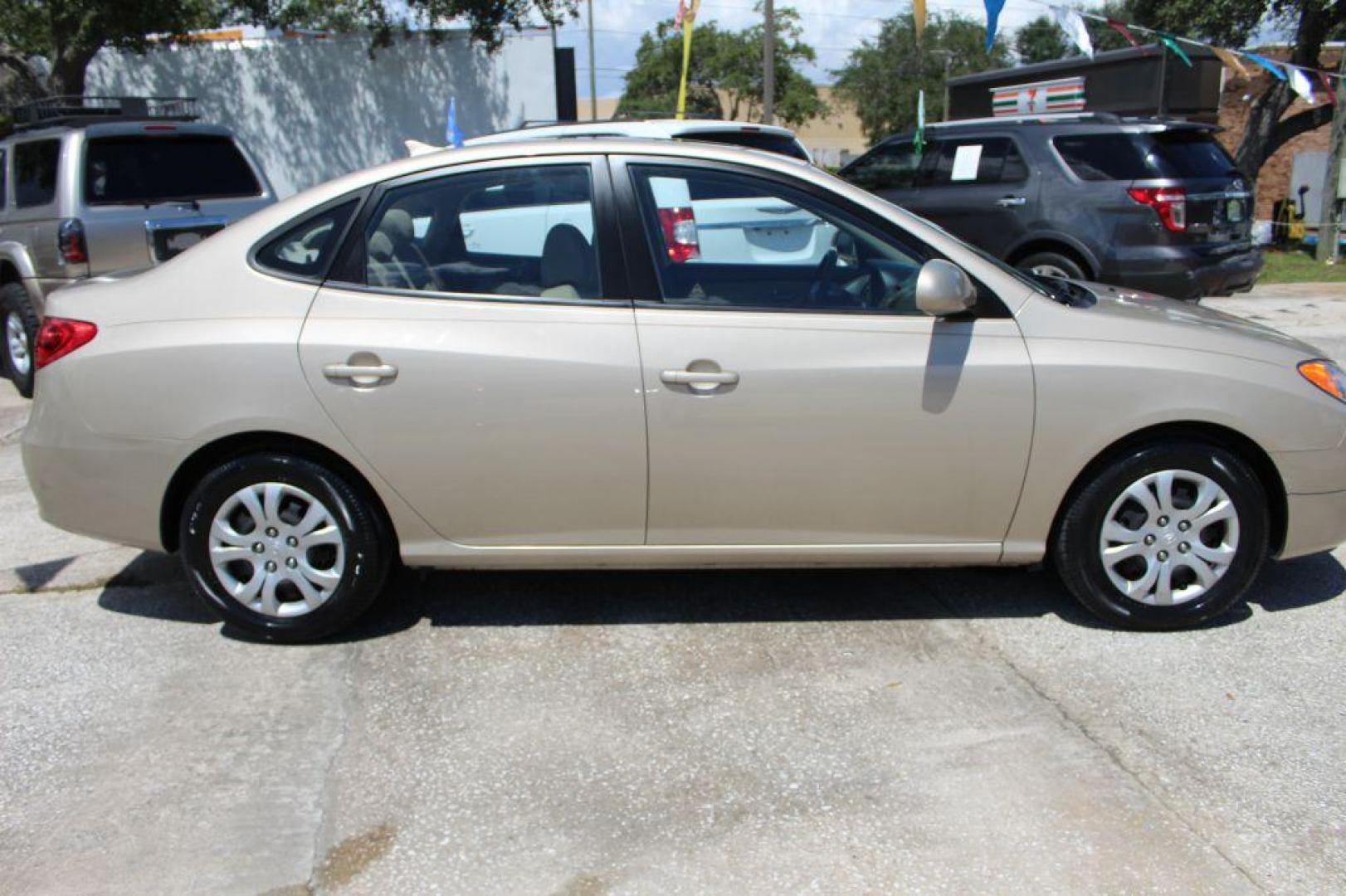 2010 GOLD HYUNDAI ELANTRA GLS (KMHDU4AD8AU) with an 2.0L engine, Automatic transmission, located at 6921 40th St N, Pinellas Park, FL, 33781, (727) 366-8136, 27.834944, -82.687653 - Gorgeous Elantra, Extremely Clean inside and out with Super low miles. Just been Fully Serviced and inspected. Brand New Tires Installed, New Brakes, Fresh Oil and Filter Change. This Vehicle is reliable and will take you anywhere in style and comfort. Would make a Great Student Car, Commuter GAS - Photo#5