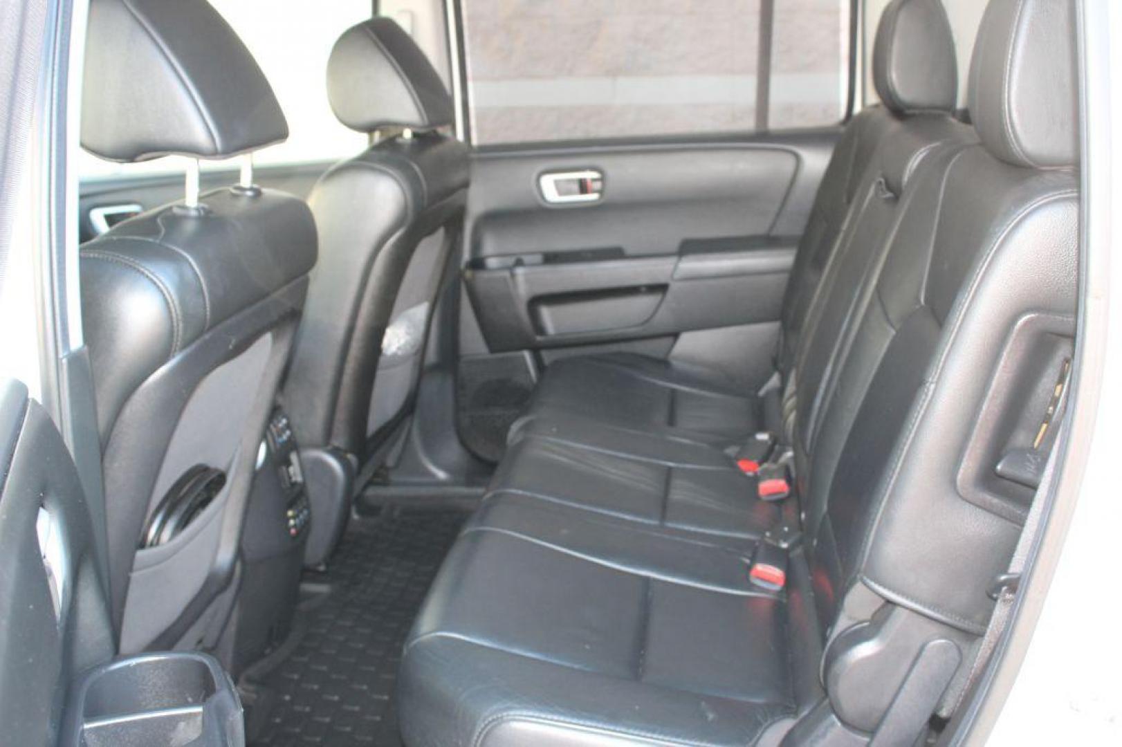 2012 WHITE HONDA PILOT TOURING (5FNYF4H97CB) with an 3.5L engine, Automatic transmission, located at 6921 40th St N, Pinellas Park, FL, 33781, (727) 366-8136, 27.834944, -82.687653 - ONE OWNER 2012 HONDA PILOT - Full Clean Carfax Report - Loaded with 3rd Row Seating, Black Leather Interior, All Wheel Drive, Built in Sun Shades on Back Windows, DVD Player with Headphones included, Navigation, Back Up Camera, Bluetooth and Aux input options, and MUCH MORE! Must See! *****100% T - Photo#19